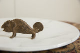 Detailed view of the vintage bronze chameleon's textured head, eye, and scales.