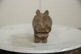 Frontal view of the vintage African bronze hippo's face and open mouth.