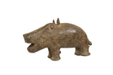 Vintage African bronze hippo collectible with a textured, time-worn patina.
