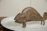 Textured bronze surface and circular eye carving on a vintage African chameleon.