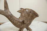 Textured scales and segmented dorsal fin on vintage African bronze fish.