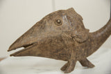 Weathered patina and primitive details on the head of a vintage African bronze fish.
