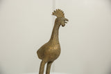 Vintage African bronze long legged bird's textured head, comb, and open beak.