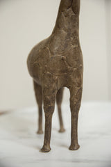 View of the vintage bronze giraffe's torso, showing its textured hand-etched spiral design.