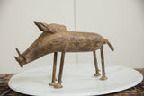 Full side view of the vintage African bronze warthog showing its aged, textured patina.