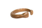 Antique African copper snake bracelet with a smooth, heavy form and time-softened patina.