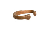 Antique African copper snake bracelet with a smooth, heavy form and aged patina.