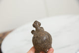 Vintage bronze turtle sculpture seen from behind, highlighting the handmade etched shell.