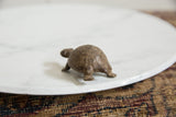 Rear view of the vintage African bronze turtle, highlighting the handmade texture on its shell.