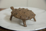 Textured vintage African bronze turtle, featuring concentric shell patterns.