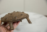Vintage African bronze turtle's shell with raised texture and concentric patterns.