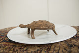 Vintage African bronze turtle's side profile, highlighting the hand-worked shell texture.