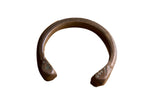 Antique African copper snake cuff bracelet with etched craftsmanship and a rich, dark patina.