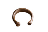 Antique African copper snake cuff bracelet with a thick C-shape and time-worn patina.