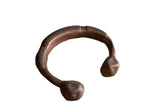 Antique African copper snake cuff bracelet with a warm patina and hand-etched geometric details.
