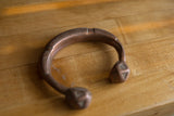 Hand-etched geometric details and rich patina on an antique African copper cuff.