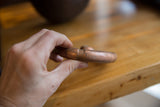 Aged patina and hand-formed shape of a solid antique copper cuff bracelet.