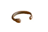 Antique African copper snake cuff bracelet with etched details and a warm, aged patina.