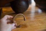 Antique copper snake cuff bracelet profile showing etched details and snake head ends.