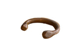 Antique African copper snake cuff bracelet with a heavy, hand-formed shape and warm patina.
