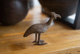 Vintage African bronze Kori bustard bird showing its textured profile and handmade charm.