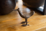 Vintage African bronze bird sculpture with a textured dark patina.