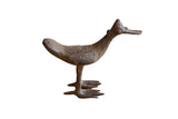 Handmade vintage African bronze bird with a flat bill and a dark, rustic patina.