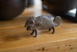 Handmade vintage African bronze chameleon with detailed texture and coiled tail.