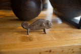 Handmade bronze chameleon sculpture showing textured head and detailed facial features.