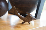 Vintage African bronze standing fish in profile with a rustic, textured patina and incised details.