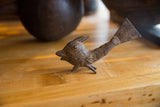 Handmade bronze African fish with textured, incised patterns and a large triangular tail.