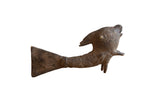 Vintage African bronze standing fish with a textured body and aged, dark patina.
