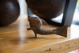 Vintage African bronze fish collectible with a dark, textured patina viewed in profile.