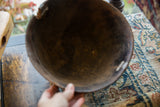 Aged interior of the vintage African wooden bowl, displaying its characteristic cracks and chips.