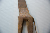 Hand-etched pattern and aged bronze patina on the hip of a vintage African giraffe sculpture.