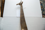 Close view of the vintage bronze giraffe head, detailing its aged texture and patina.
