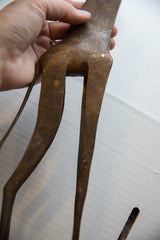 A detailed view of the hand-etched spot patterns on the bronze giraffe.