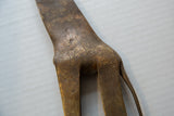 Hand-etched textural patterns on the back of the vintage African bronze giraffe sculpture.