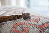 Serrated and incised geometric patterns on a handmade African wooden spoon.