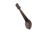 Vintage African wooden spoon with an instrument design handle and hand-carved geometric details.