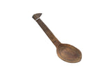Vintage handmade African wooden spoon with a dark patina and incised patterns.