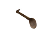 Hand-carved vintage African wooden spoon with a dark, aged patina and distinctive handle.
