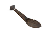 Vintage African wooden spoon with a rich dark patina and hand-carved geometric details.