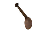 Vintage handmade African wooden spoon with a dark patina and carved geometric handle.