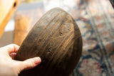 Hand-carved geometric details and the aged texture of a vintage African bowl.