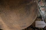 The rich, time-worn texture and small cracks inside the handmade vintage wooden bowl.