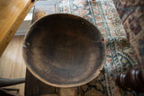 Overhead view of the vintage African bowl's time-worn interior and rustic, notched rim.