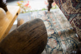 Hand-carved geometric patterns on the aged, dark wood of the African bowl.