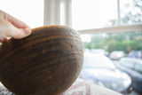 Aged patina and hand-carved geometric details on a vintage Tuareg wooden bowl.