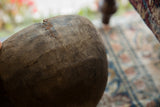 Vintage African Wooden Bowl: textured rim with crack and reddish-brown repair.